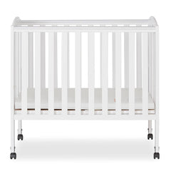 Dream on Me 2 - in - 1 Folding Portable Mini Crib in White. Mattress Pad Included. Easy to Fold and Store Baby Crib. Two Adjustable Mattress Height Positions Convertible Crib