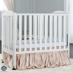 Dream on Me 2 - in - 1 Folding Portable Mini Crib in White. Mattress Pad Included. Easy to Fold and Store Baby Crib. Two Adjustable Mattress Height Positions Convertible Crib